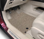 Car interior with beige floor mat on a white background