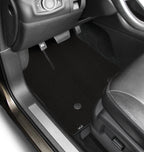 Car interior with black floor mats on a white background