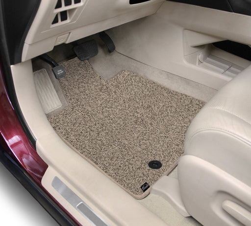 Car interior with beige floor mat on a white background