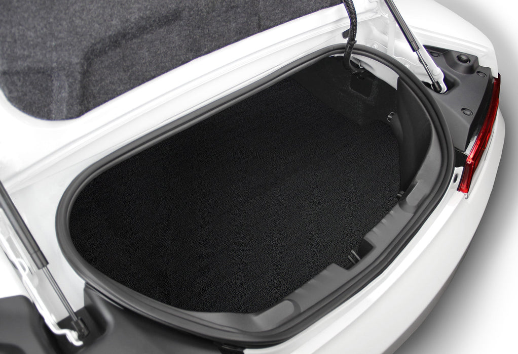 Open car trunk with a black cargo liner