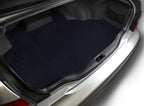 Car trunk with a black textured mat on a white background