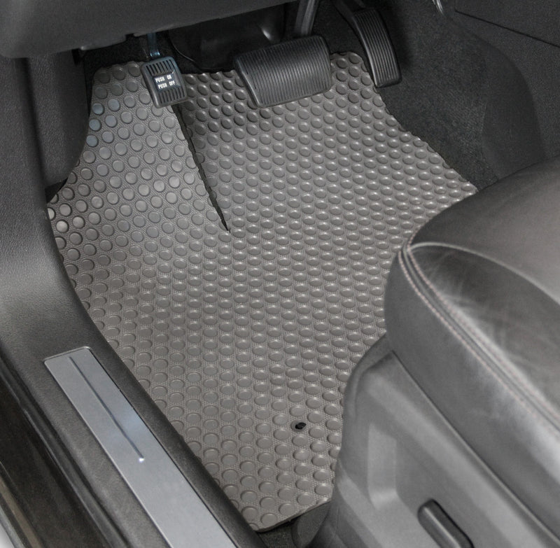 Gray car floor mat in a vehicle interior