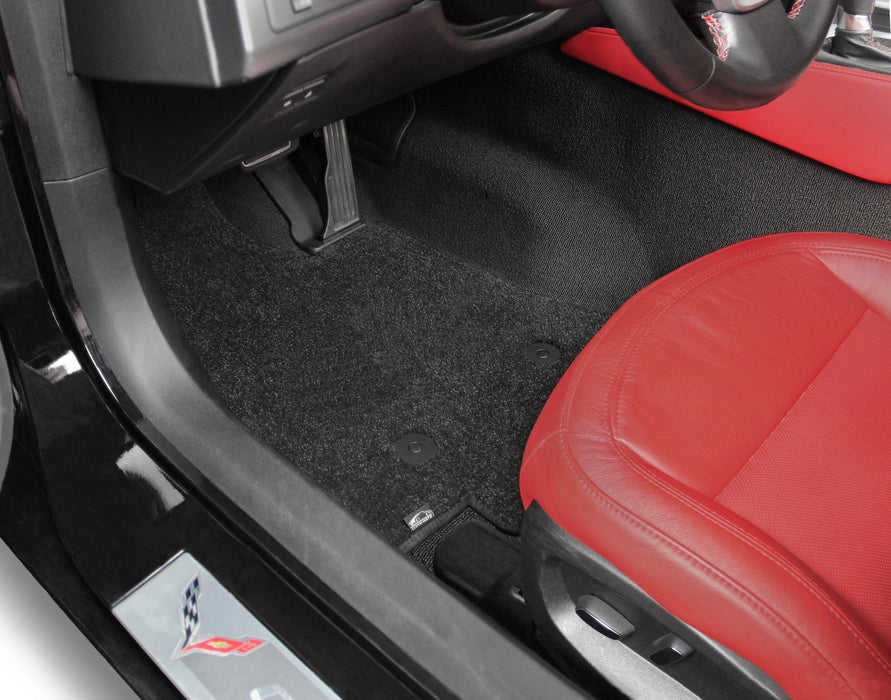Car interior with red seat and black floor mat
