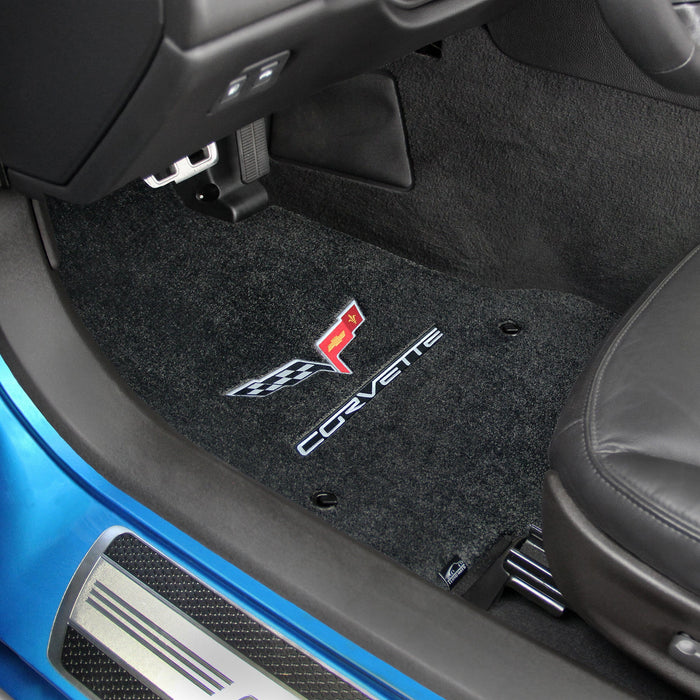 Car interior with black floor mats featuring Corvette logo