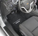 Car interior with a focus on the steering wheel and dashboard, featuring the Chevrolet logo.