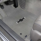 Car floor mat with Chevrolet logo on a vehicle interior