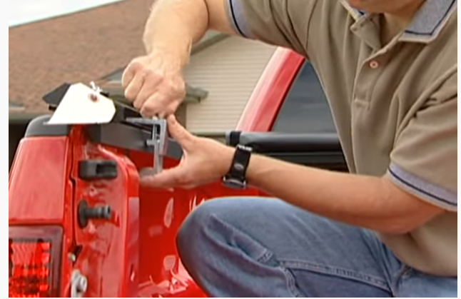 Man tightening the front clamps