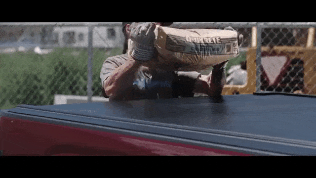 Animated gif of cement bag tossed on top of tonneau cover