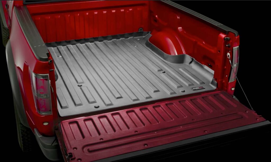 A pickup truck bed installed with black WeatherTech liner