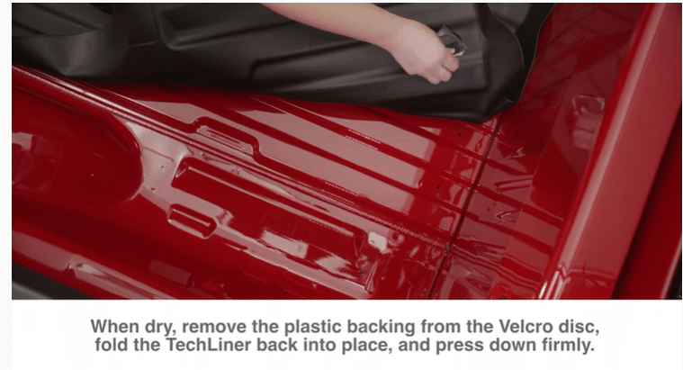 Woman removing the Velcro disc from the plastic backing