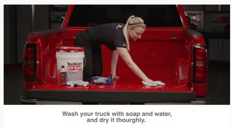 Woman washing the truck bed